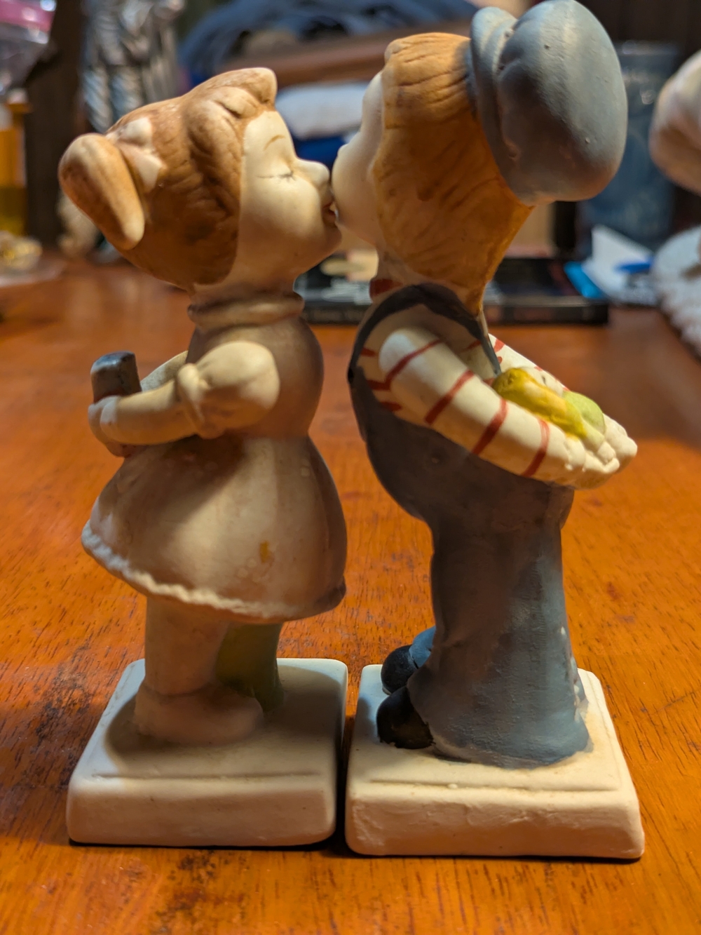 Source Unknown Blue & Cream Kissing Children Ceramic Sculpture Pair